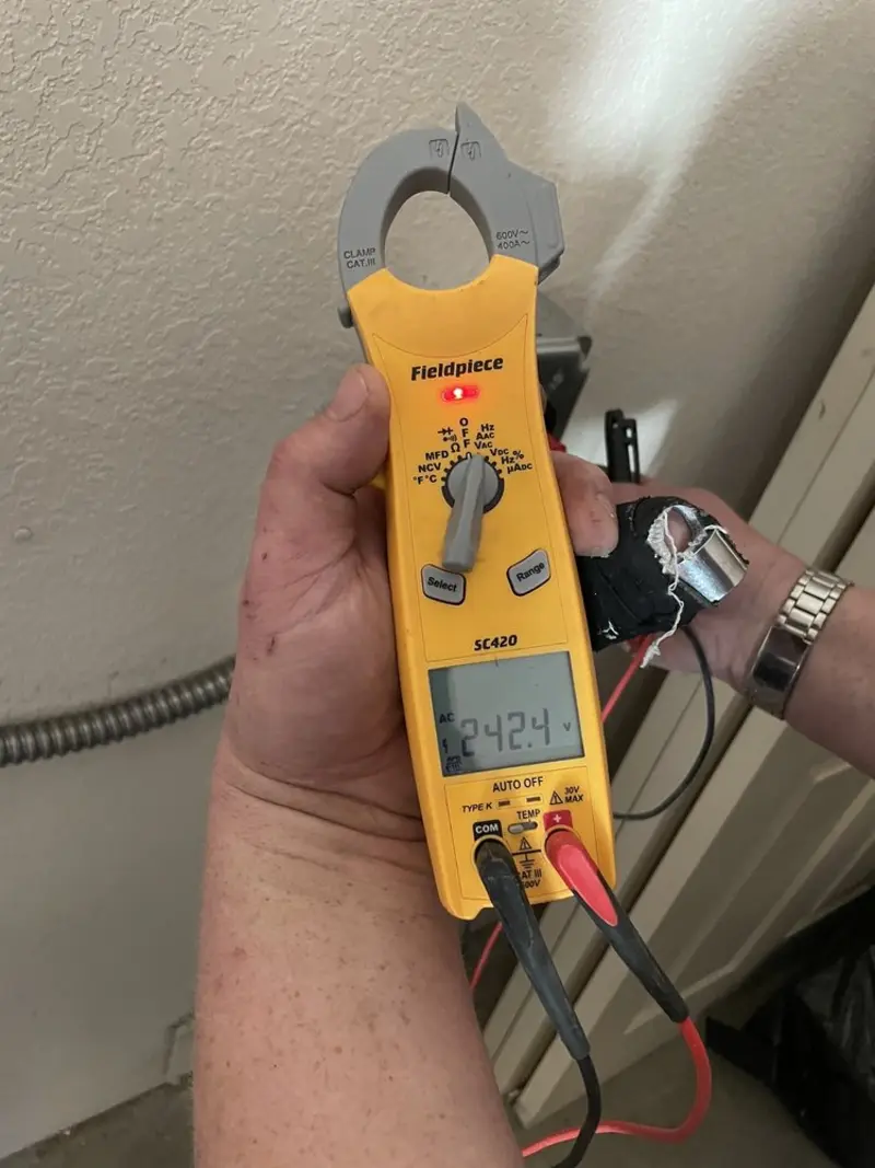 Voltage testing with clamp meter during Recessed Lighting Installation in Bayou Cane